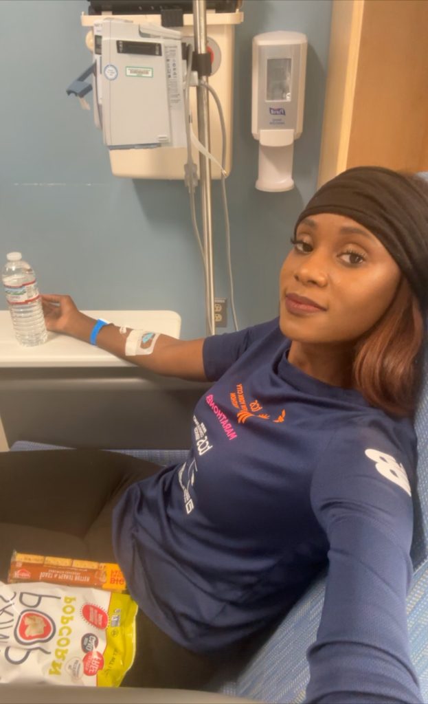 Marion Jones sitting in hospital with snacks.
